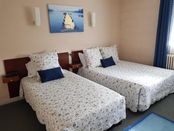 Chambre confortable pour trois personnes